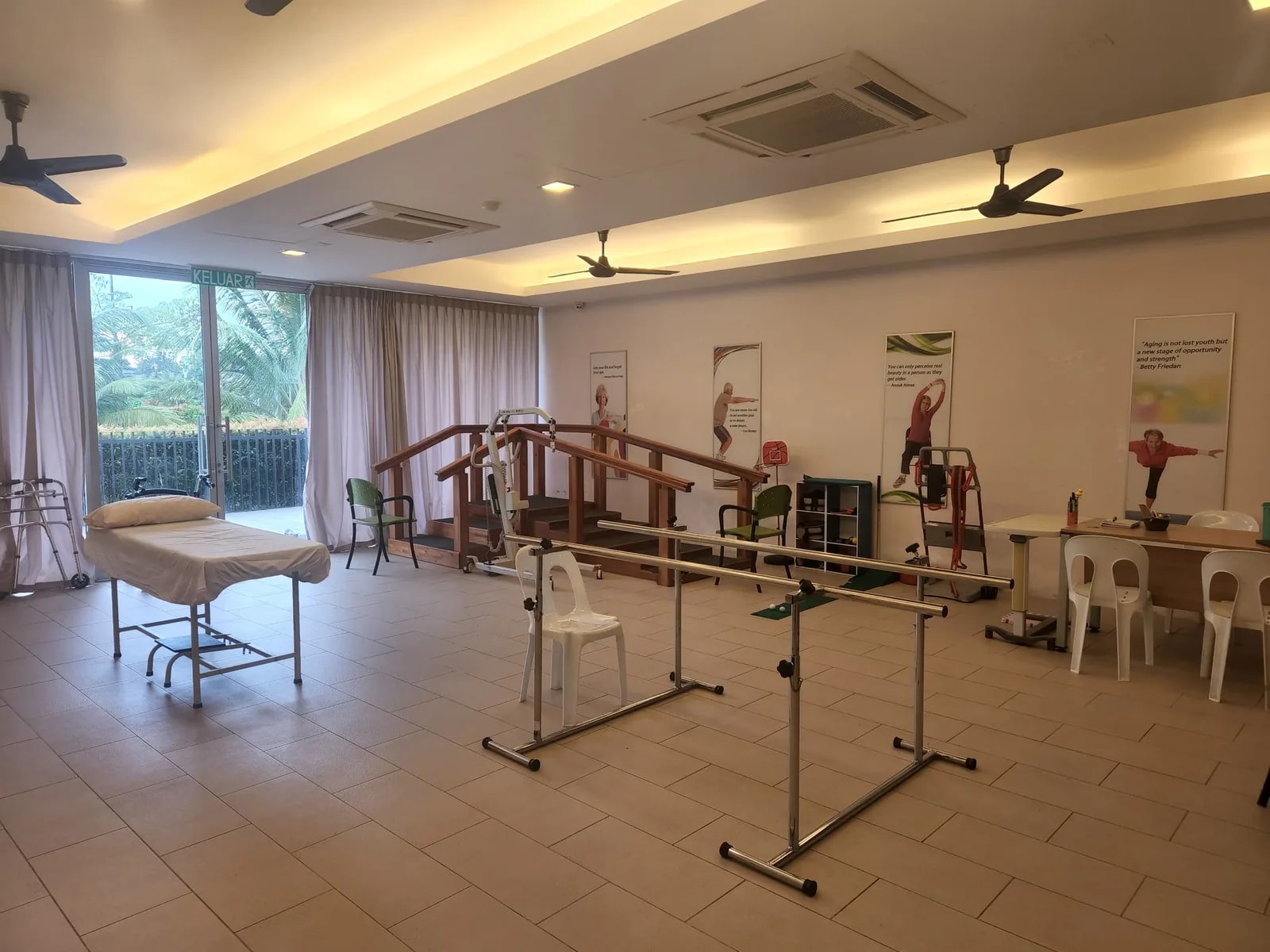 Physiotherapy room at Eden on the Park with parallel bars and exercise equipment