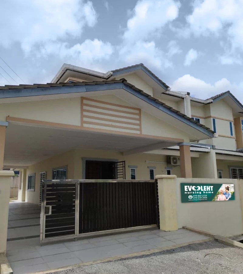 A house used as an Evoleht nursing home, with the Evoleht signboard on the gate wall