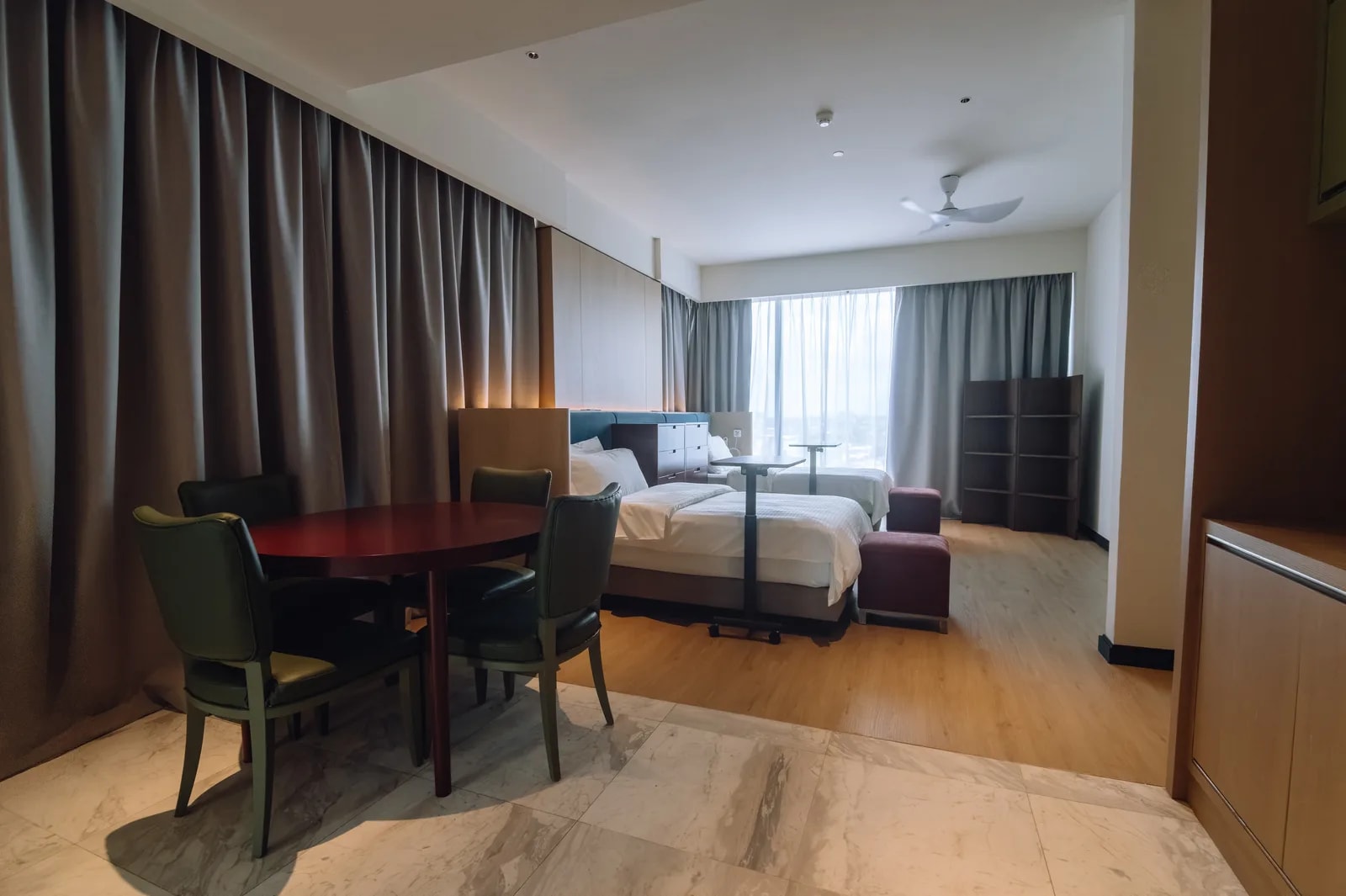 Twin suite at Care Collective with two beds and a dining table